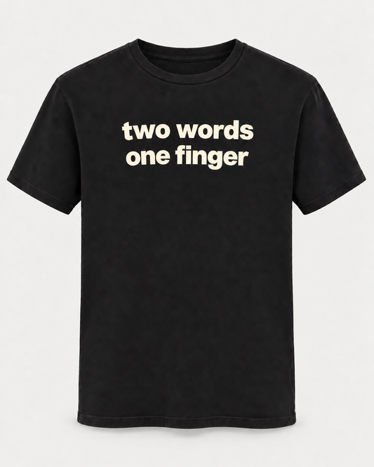 The R13 Two Words One Finger Tee features bold white lettering across the front stating “two words one finger.” Designed by R13, this vintage-inspired graphic tee offers a relaxed fit that combines bold attitude with effortless comfort.