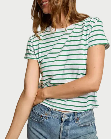 A person wears the perfectwhitetee Everett Stripe Boxy Crewneck Tee with green stripes and blue jeans, standing against a light background with one arm bent and the other at their side.