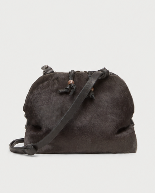 Handmade in Italy, the dark brown Henry Beguelin Bolla Pony Crossbody features a textured pony hair leather finish, a drawstring closure, and a leather shoulder strap.