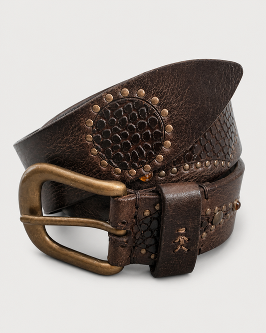 The Henry Beguelin Break Belt by Henry Beguelin is a coiled, dark brown handcrafted Italian leather belt with a brass buckle, featuring circular studded patterns and textured detailing, displayed on a plain white background.