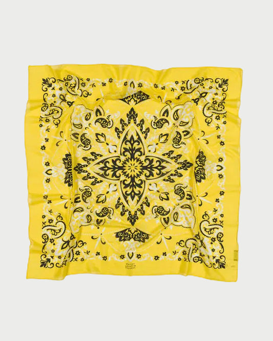 Yellow bandana with black pattern on a white background