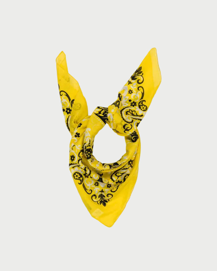 Yellow bandana with black patterns on a white background