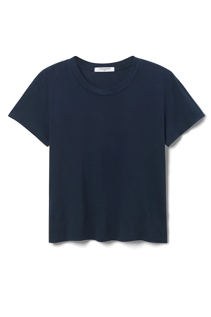 The Harley Boxy Crew in Black and White by perfectwhitetee is a versatile layering piece with a classic short-sleeve design and round neckline, available against both black and white backgrounds. This plain T-shirt is ideal for pairing with multiple colors, seamlessly complementing any wardrobe.