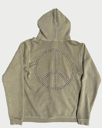 The Madeworn Flower Power Hoodie by Madeworn features a khaki hue and a large peace symbol on the back, embellished with metallic studs for a vintage athleisure look.