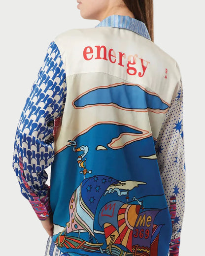 Person wearing a colorful jacket with 'energy' text and nautical design on a white background