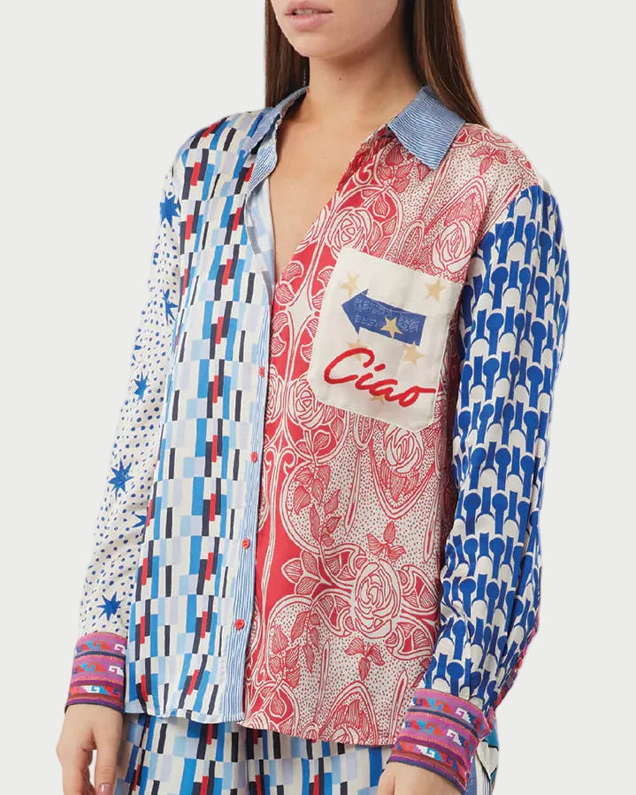 Woman wearing a colorful patterned shirt with a 'Ciao' design on a white background