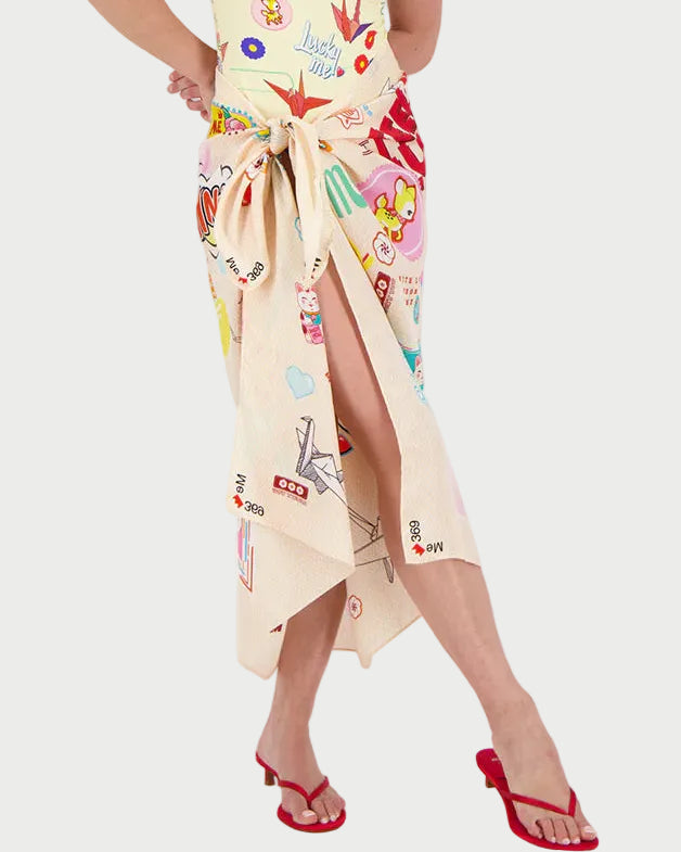 Woman wearing a colorful pareo with a white background