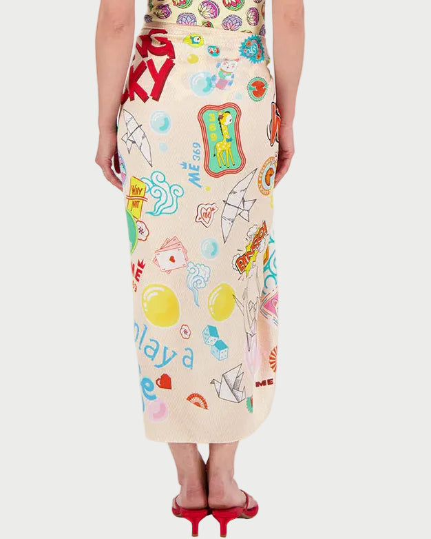 Woman wearing a colorful pareo with various designs on a white background