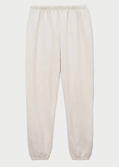 The Perfectwhitetee Johnny Sweatpant in Sugar by perfectwhitetee is crafted from soft French terry cotton with an elastic waistband and ankle cuffs, shown on a plain white background.