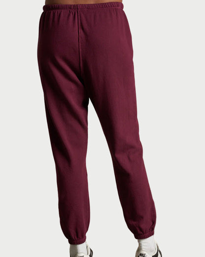 Perfect White Tee burgundy johnny sweatpants worn by a person on a plain background