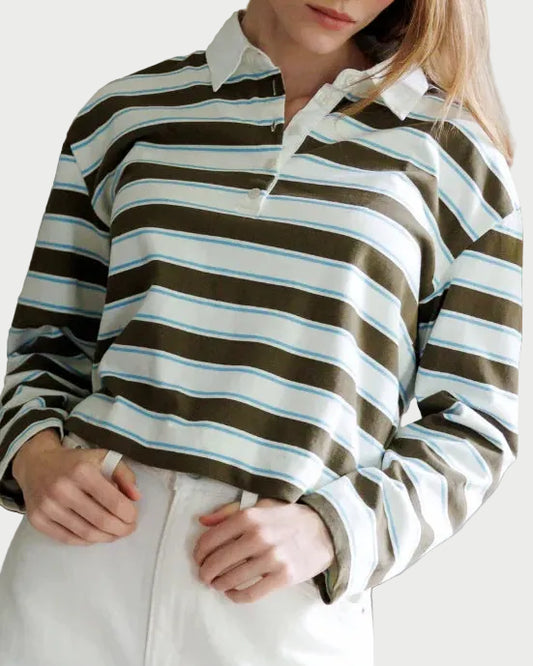 Woman wearing a striped shirt in an indoor setting