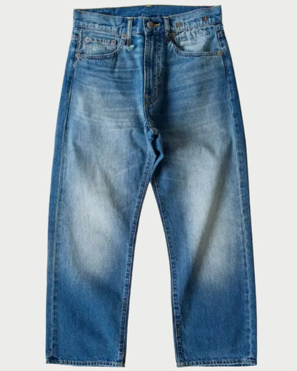 A pair of blue denim jeans with a faded wash, laid flat against a light gray background.