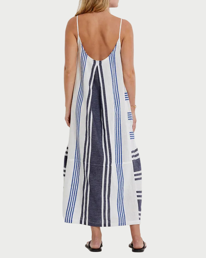 Woman wearing a striped dress with a white background
