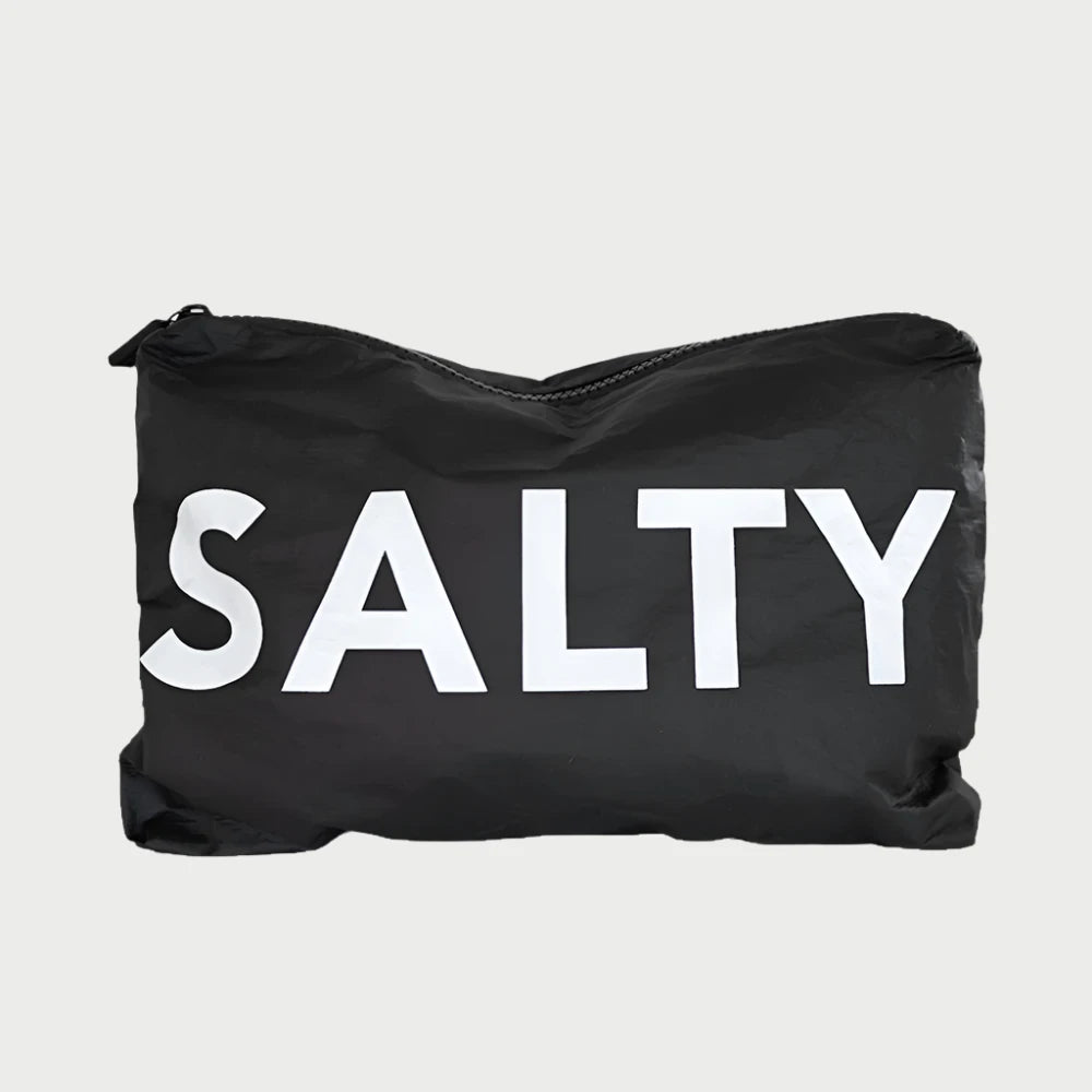 Introducing the LOCAL BEACH Printed Pouch - Salty: a black water-resistant zippered pouch made from 100% Tyvek, featuring the word "SALTY" prominently displayed in large white letters on the front, perfect for safeguarding your travel toiletries.