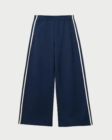 The perfectwhitetee Mikos Wide Leg Pant by perfectwhitetee is a high-waisted, navy cotton pant with white outer stripes and an elastic waistband, shown laid flat on a plain white background.