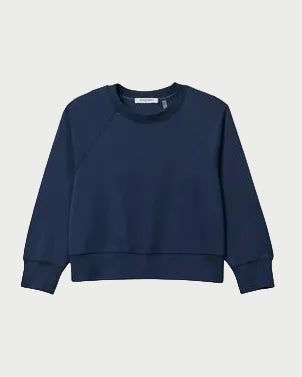 The perfectwhitetee Nell Travel Crewneck Sweatshirt by perfectwhitetee is a plain, long-sleeve navy blue heavyweight fleece with ribbed cuffs and hem, shown against a light gray background.