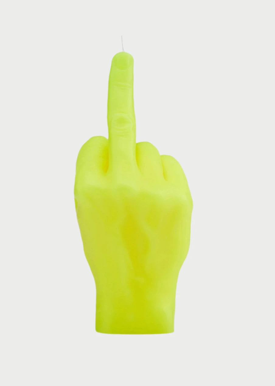 A bright yellow, hand-shaped candle with the middle finger extended upward, perfectly capturing that f*ck-off mood. With a single wick atop the defiant finger and set against a plain white background, the F*ck You Candle Hand by 54° Celsius adds a cheeky vibe to any space.