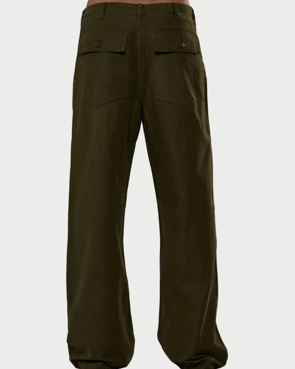 Green cargo pants on a gray background