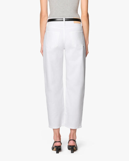 A person is shown from the back against a plain white background, wearing a gray sleeveless top, black belt, black open-toe heeled sandals, and the Ellen Bow Leg Pant by Betro Simone in white premium fabric.