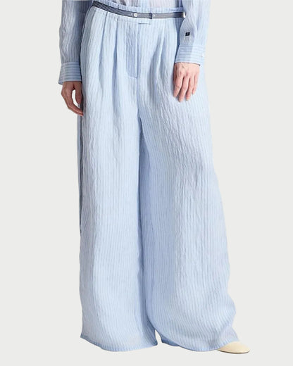 Light blue striped pants worn by a person on a white background