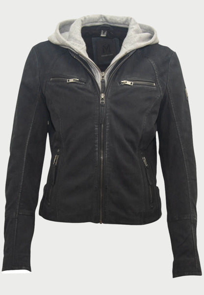 The Soft Nubuck Leather Jacket by Mauritius is a black nubuck leather moto jacket with a gray removable hoodie. It features zippers on the front, chest pockets, side pockets, and has a badge on the left sleeve.
