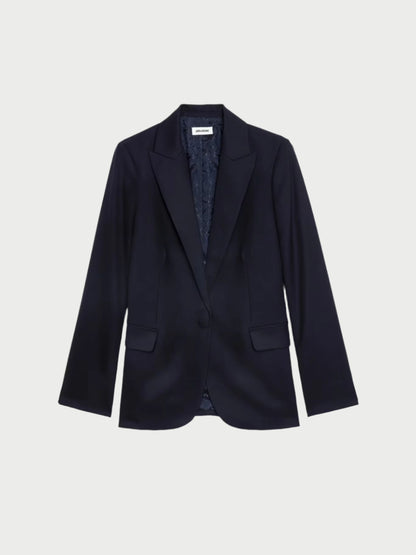 The Tailored Navy Blazer by Zadig & Voltaire features a sleek straight-cut design with a single button, long sleeves, and two front pockets. Its grain wool sophistication is enhanced by the visible lining, elegantly showcased against a plain white background.