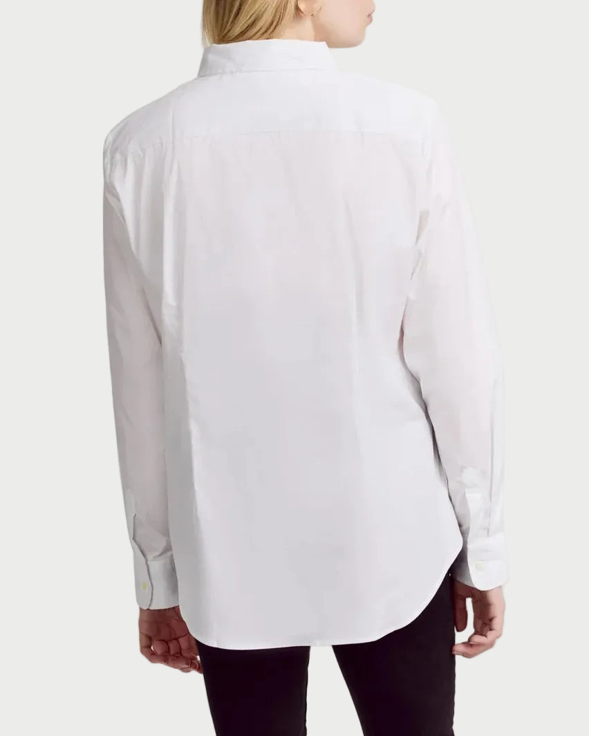 Woman wearing a white shirt and black pants on a white background