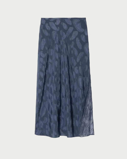 The Zadig & Voltaire Jayla Paisley Skirt is an ankle-length, navy silk skirt featuring a subtle paisley pattern and a slight flare at the hem, shown against a plain white background.
