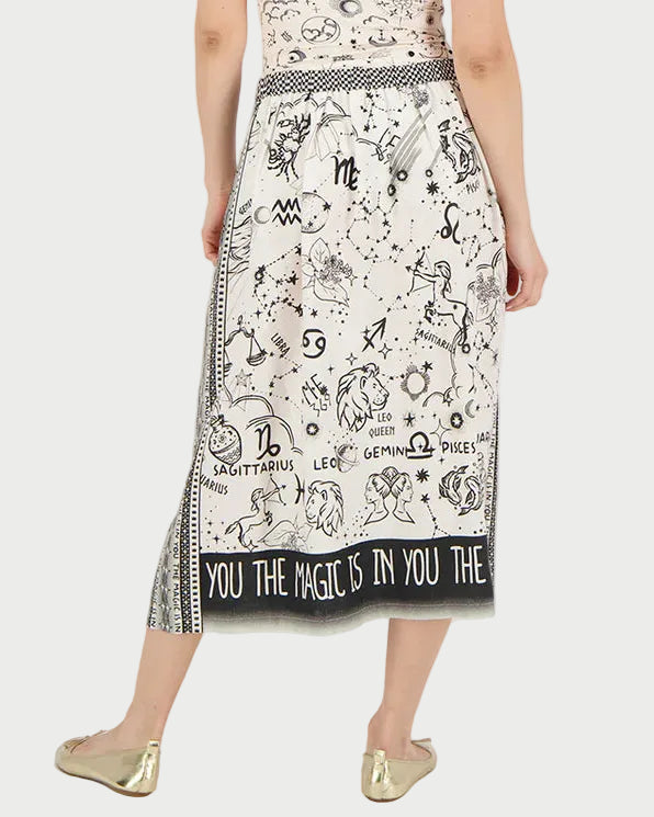 Woman wearing a sleeveless dress with black patterns and text on a white background